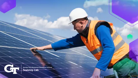 man working on solar panels